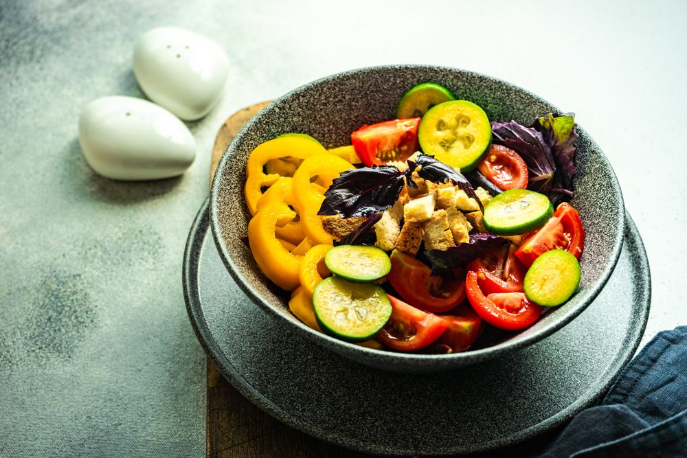 Healthy gourmet vegetarian salad in bowl on counter