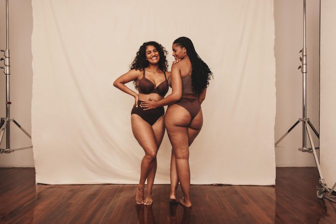 Two best friends modeling in body positive photoshoot