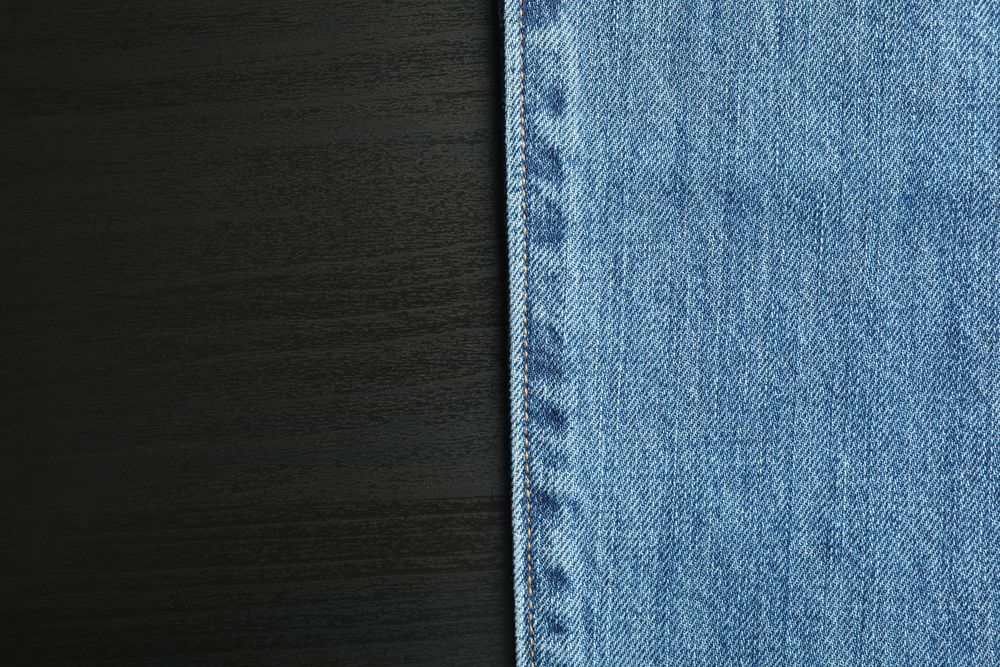 Classic jeans on background, space for text