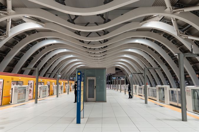 Tokyo’s Shibuya station platform with M-shaped white ceiling