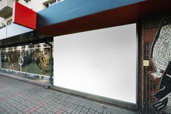 Black advertising panel on side of building