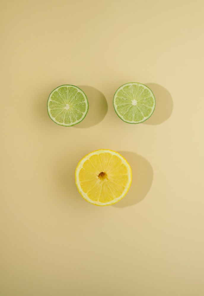 Top view of two lime slices and one lemon