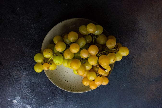 Plate of grapes on grey plate
