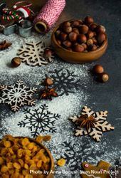 Flour on counter with Christmas baking ingredients and snow flakes 0vxG74