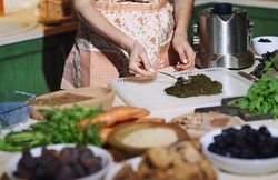 woman preparing and cooking vegetarian food