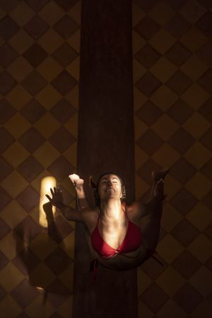 Woman dancing in dark church