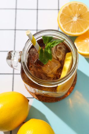 A glass of cold tea with fresh orange slices