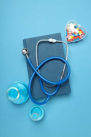 Concept of medical education and books, top view