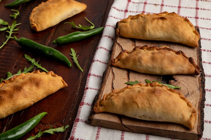 Set of patties between herbs and chili on napkin