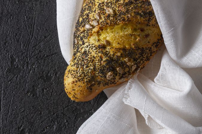 Loaf of bread with grains and poppy seeds