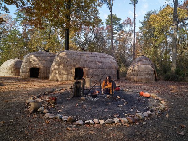 Historical reenactment near Yehakhin huts, Powhatan Indian Village, Jamestown, Virginia
