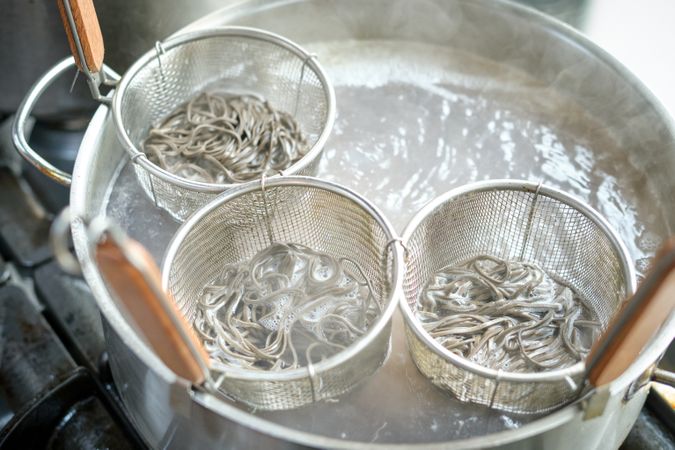 Process of cooking noodles in saucepan with boiling water