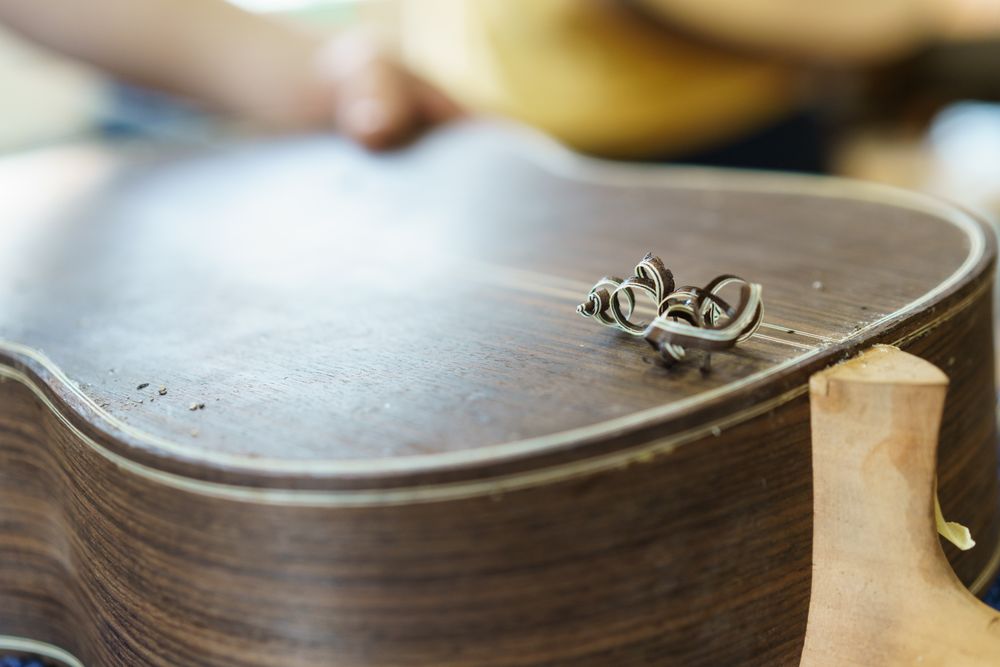 Back of guitar being carved