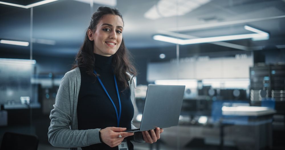 Portrait of an Empowered Woman Looking at Camera and Charmingly Smiling.