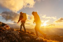 hiking in the mountains at sunset