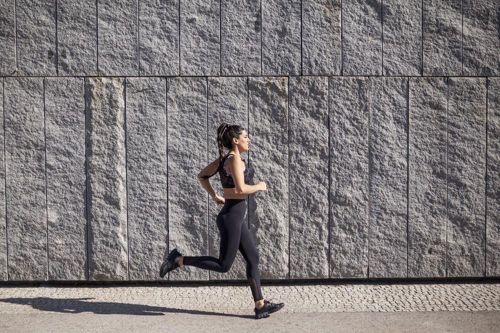 brunette woman running