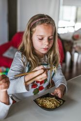 Girl eating vegan food at home