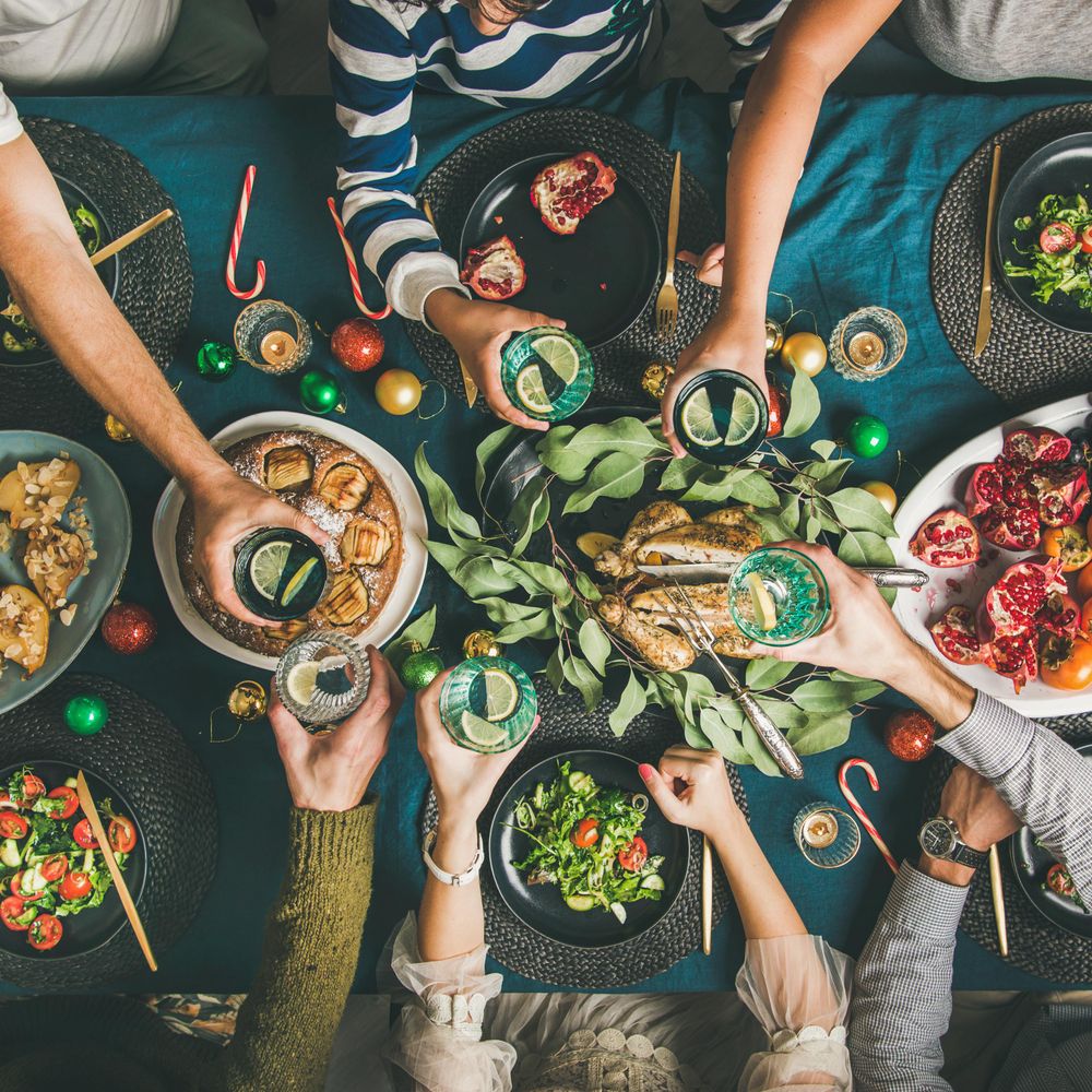 Christmas or New Year party dinner at festive table, top view, square crop