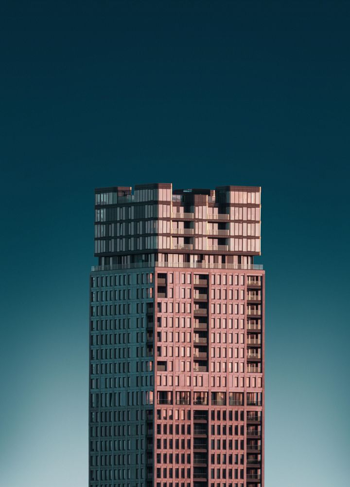 Unique residential building against a dark blue sky