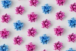 Pattern of plastic pink and blue decorative gift bows