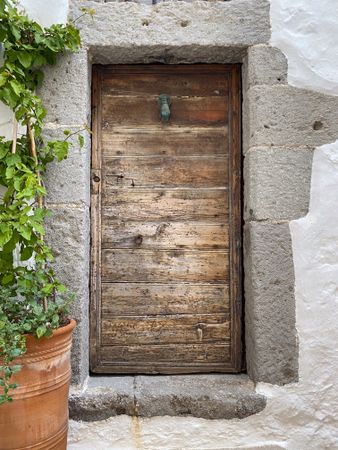 Patmian wood door with hand knocker