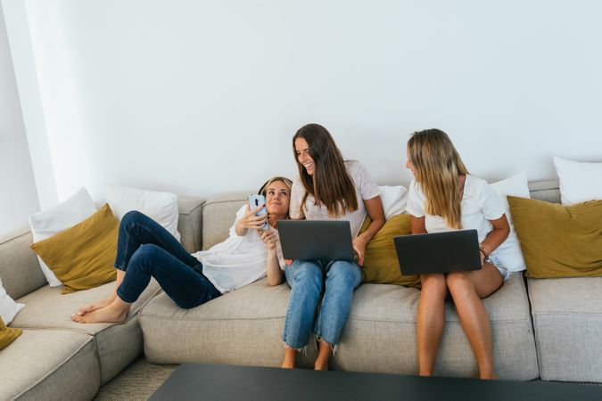 Woman showing video to positive friends