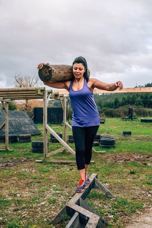 Sportswoman carrying trunks