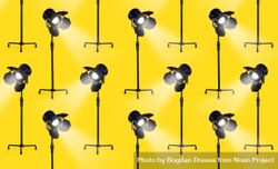 Multiple studio lamps over yellow background 4dEmrb