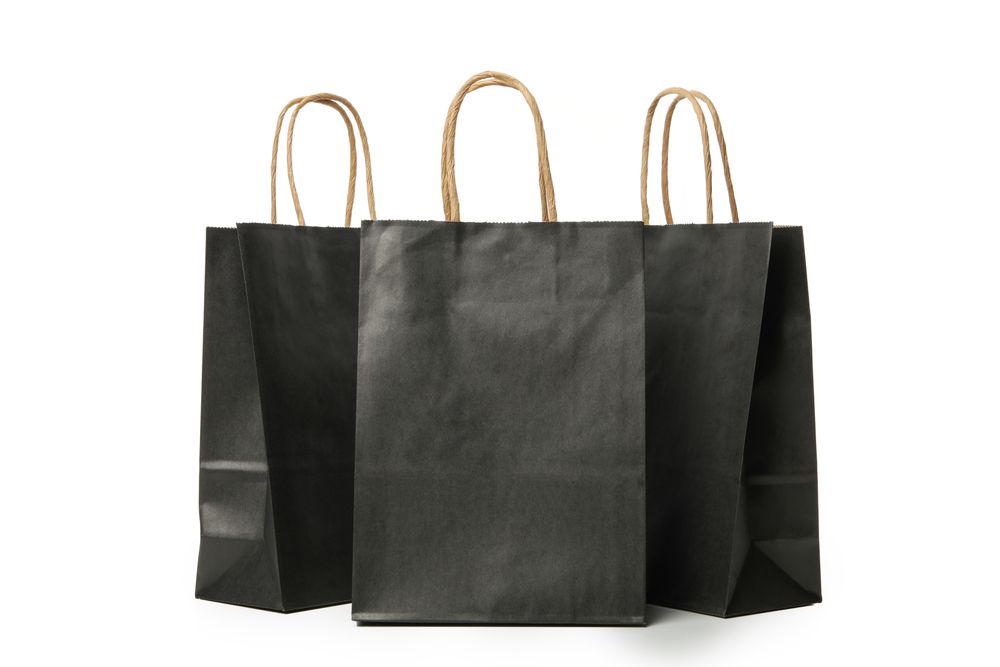 dark paper bags isolated on light background