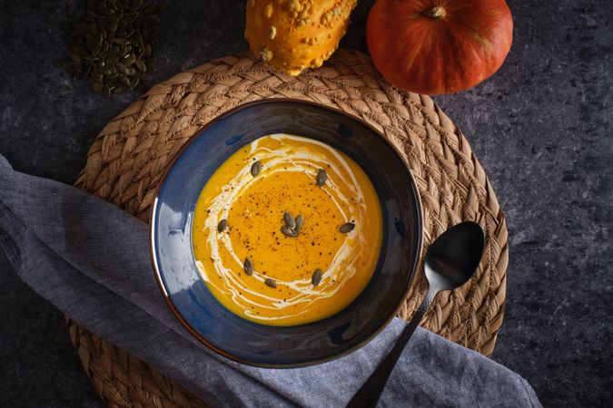Tasty pumpkin cream soup in bowl