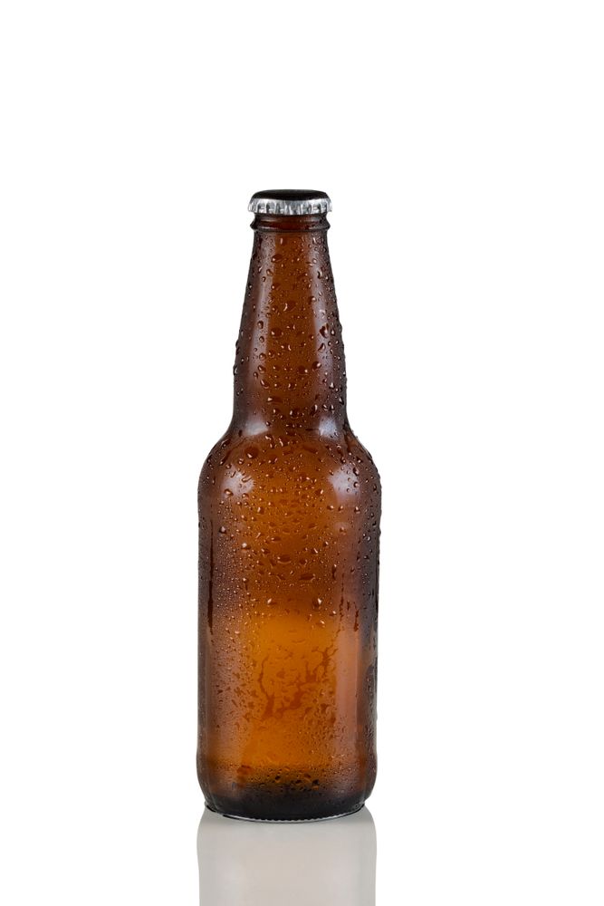 Unopened cold beer bottle