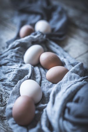 Raw eggs on tablecloth