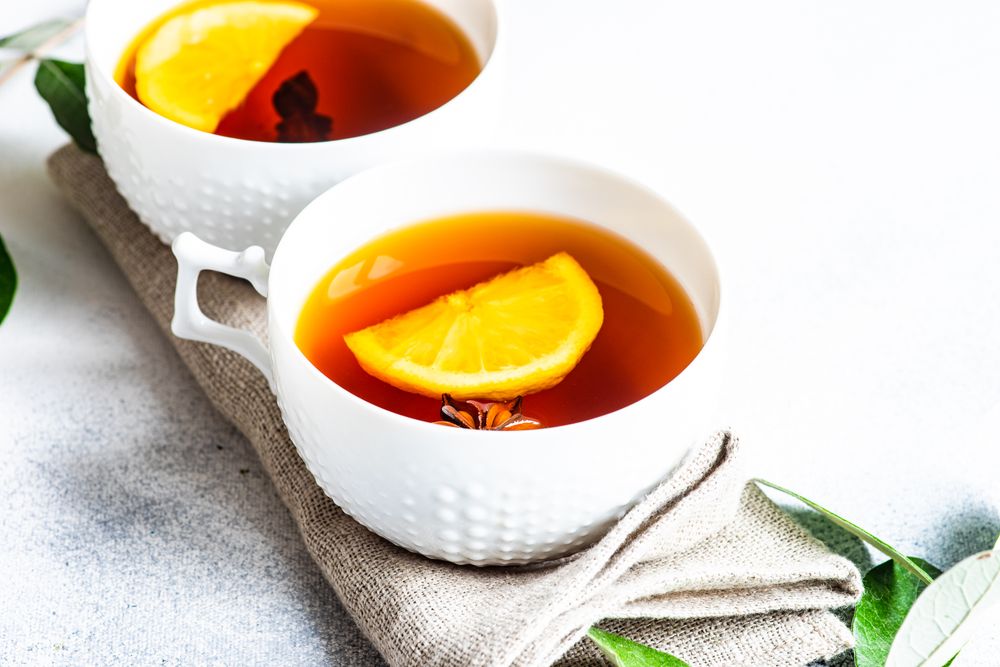Tea cups with lemon and star anise