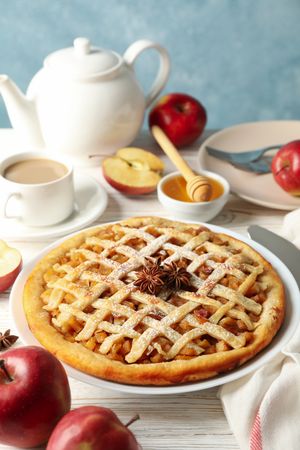 Composition with apple pie and ingredients on wooden background. Homemade food