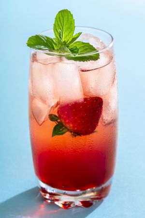 One glass of strawberry lemonade with mint