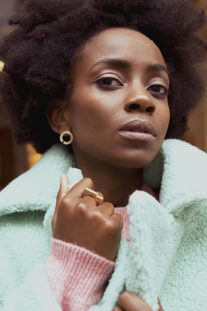 Portrait of woman in turquoise jacket