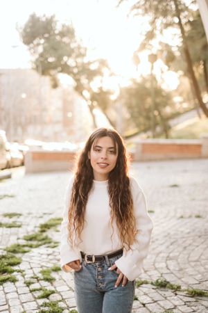 Cheerful young woman in street