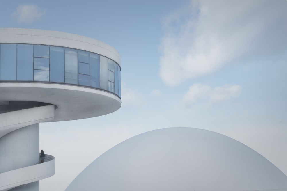 Stylish modern building on clear sky background