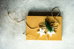 Holiday gift with star ornaments and string