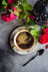 Coffee set with red roses and coffee pot on concrete background with copy space