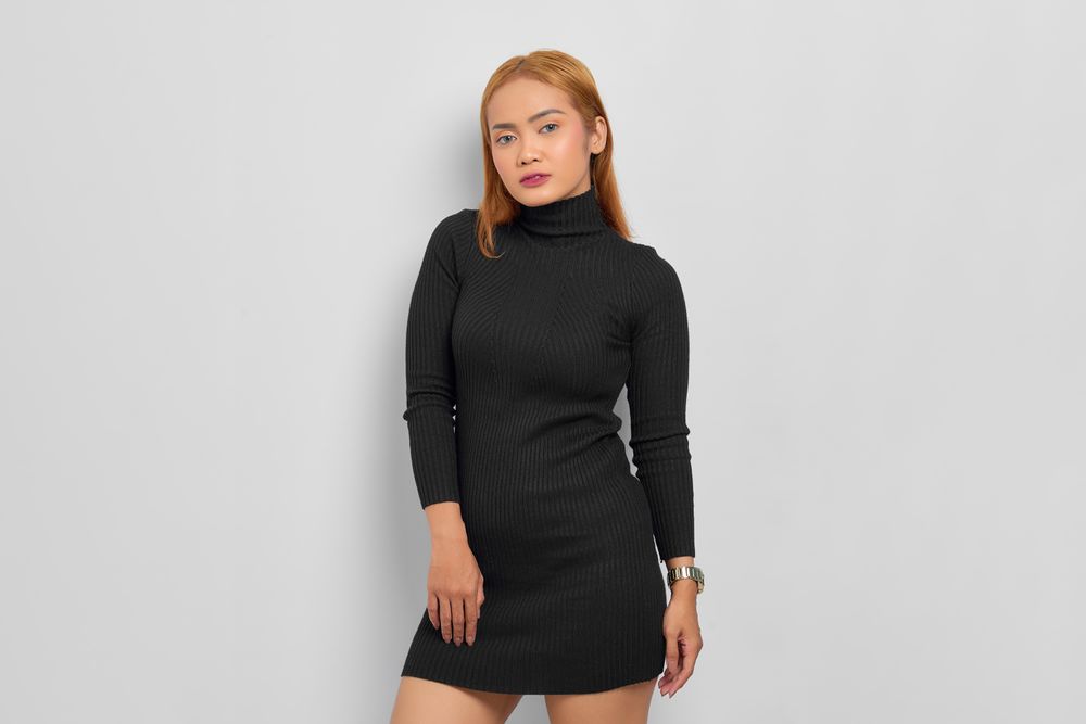 Asian woman with red hair modeling in studio
