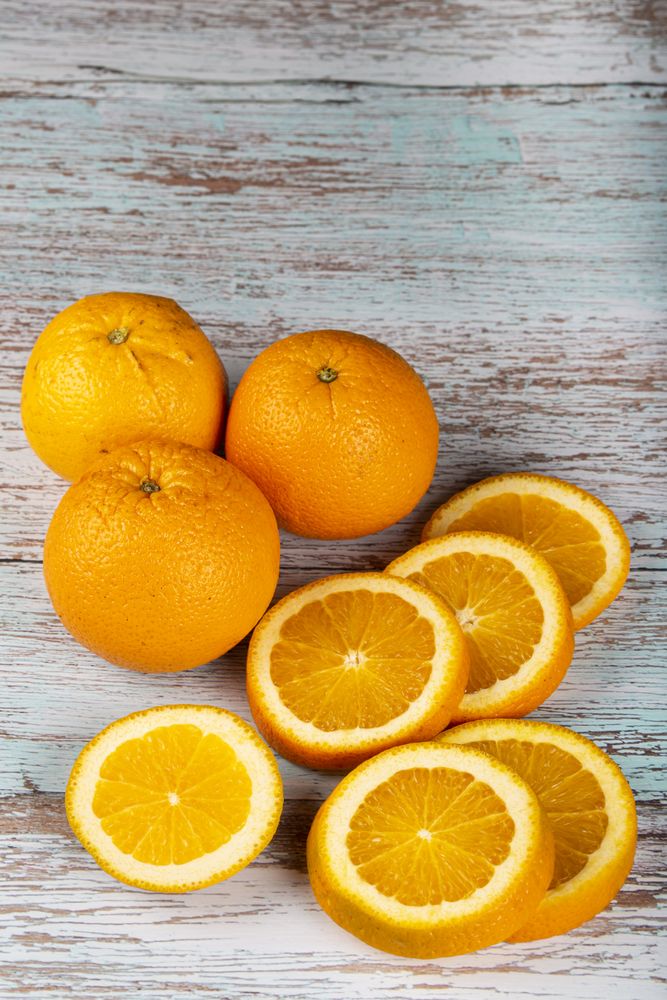 Sliced oranges on the table.