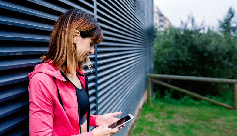 Female athlete with mobile phone