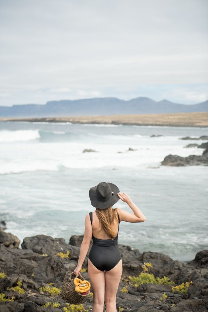 Sensual female near stormy sea