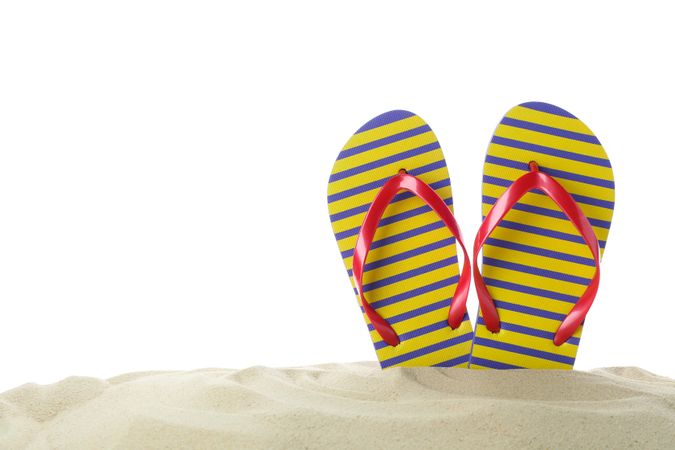 Flip flops in clear sea sand. Summer vacation