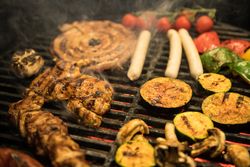Vegetables and meat on grill
