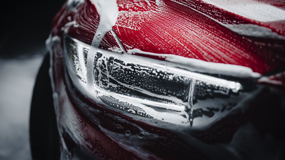 Close Up of a Modern Red Performance Car in a Dark Studio Environment.