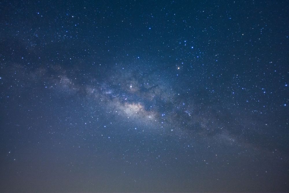 The milky way galaxy with stars and space dust in the universe, Long exposure photograph, with grain
