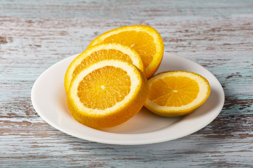 Sliced oranges on the table.