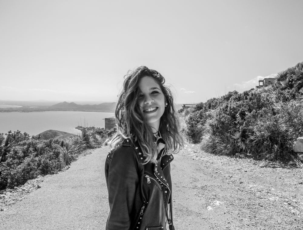 Smiling female on seashore